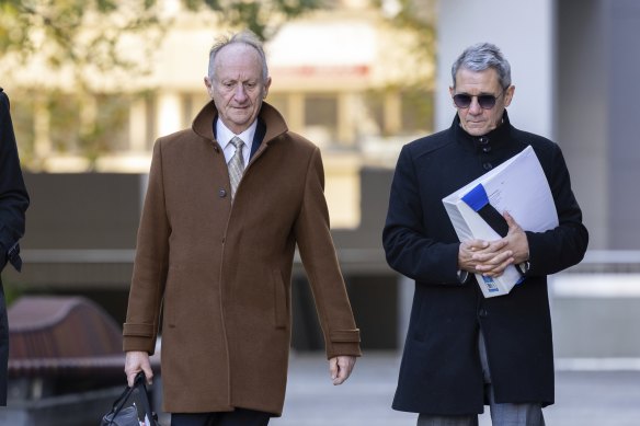Mark Tedeschi, KC (left), and Shane Drumgold arrive at the ACT Civil and Administrative Tribunal on Monday.