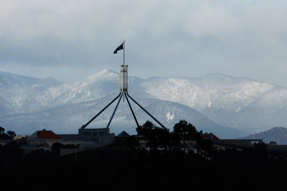 Parliament House surrounded by snow-covered mountains on Wednesday.