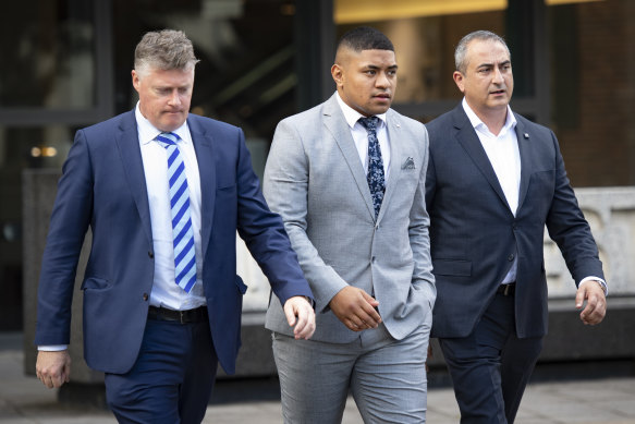 Manase Fainu (centre) is on trial in Parramatta District Court, accused of stabbing a Mormon youth leader in 2019.