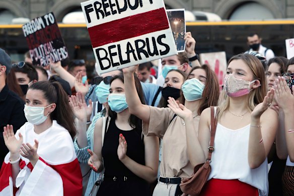 People demonstrate in Warsaw, Poland, in support of Belarusians after the troubled weekend vote.