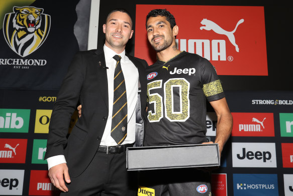 Shaun Grigg presented Marlion Pickett with his Richmond jumper on grand final day.