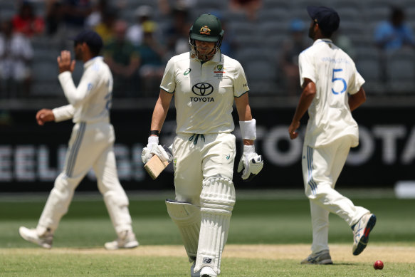 Steve Smith walks off after being dismissed by Mohammed Siraj on day four of the First Test against India in Perth.