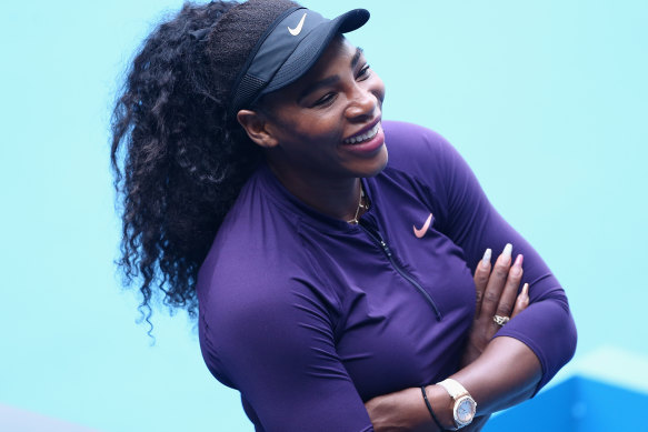 Serena Williams is all smiles after practising at Melbourne Park on Sunday but chose to bypass an official pre-tournament press conference.