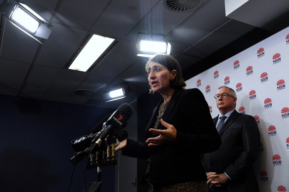 NSW Premier Gladys Berejiklian, pictured with Health Minister Brad Hazzard, addresses the media on Wednesday.