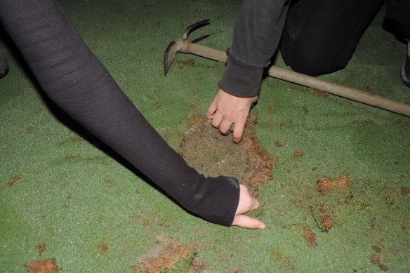 French climate activism group Extinction Rebellion Toulouse posted photos of themselves ripping up greens and pouring cement in holes.