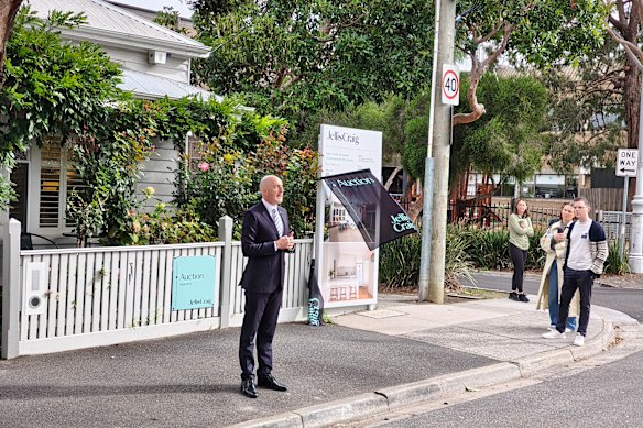 Jellis Craig Richmond auctioneer Luke Schickerling calls for bids at 266 Mary Street.