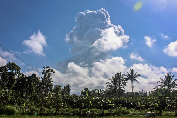 Mount Merapi spews volcanic materials during an eruption as seen from Sleman, Indonesia, on Sunday, June 21.