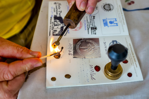 A seal wax for a Camino de Santiago Credencial is prepared  in Alvaiazere, Portugal.