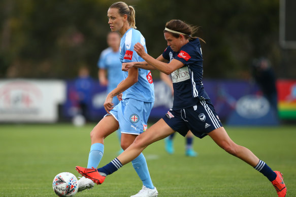 Race for the prize: City's Emily Van Egmond evades a tackle from Victory's Emily Menges during the W-League derby at the ABD Stadium in Broadmeadows, Melbourne.