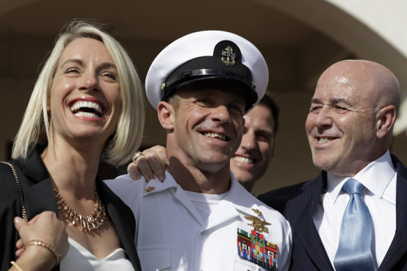 Navy Special Operations Chief Edward Gallagher, centre, leaves court with his wife Andrea, left, in July after being acquitted of murder.