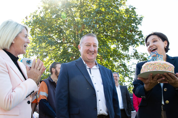 NSW Labor leader Jodi McKay presents Upper Hunter Labor candidate, Jeff Drayton, with a birthday cake in Singleton on Tuesday.