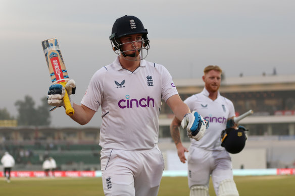 Century-maker Harry Brook salutes the crowd as he leaves the field at stumps on day one against Pakistan.