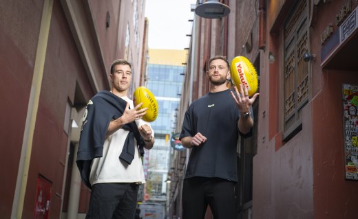Merrett (left) with defender Jayden Laverde.