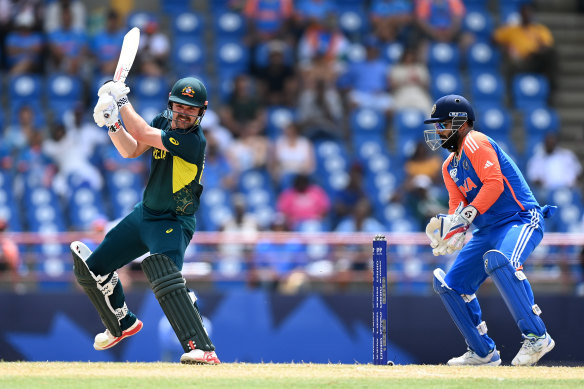 Travis Head plays a shot as India’s Rishabh Pant keeps in St Lucia.