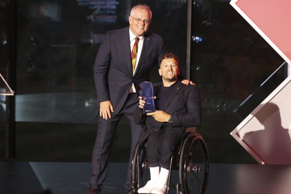 Prime Minister Scott Morrison and 2022 Australian of the Year Dylan Alcott.