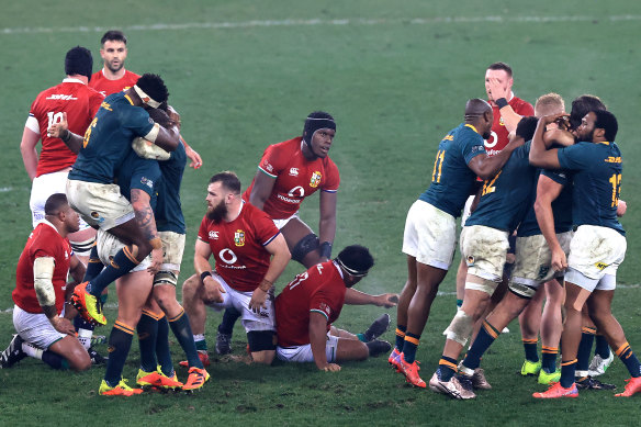 Lions and Springbok players after the final whistle.