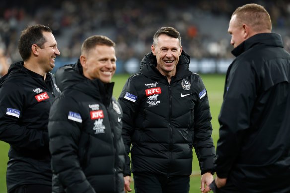 Collingwood coach Craig McRae (second from right) last year with his brains trust of (from left) Hayden Skipworth, Brendon Bolton and Justin Leppitsch.