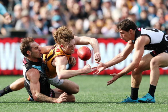 Jeremy Finlayson (left) was in the thick of the action again against Hawthorn on Saturday, laying tackles and kicking five goals