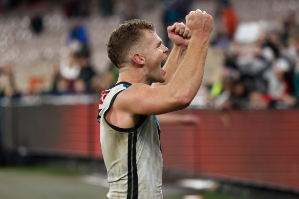 Dan Houston salutes the crowd after his matchwinning goal against the Bombers
