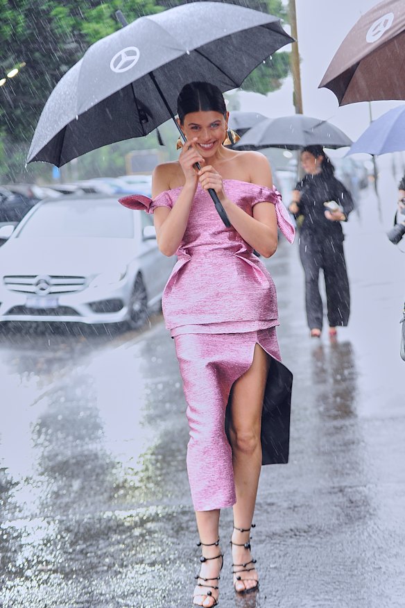 Rain on my parade ... model Georgia Fowler arrives at the Camilla and Marc show in 2018.