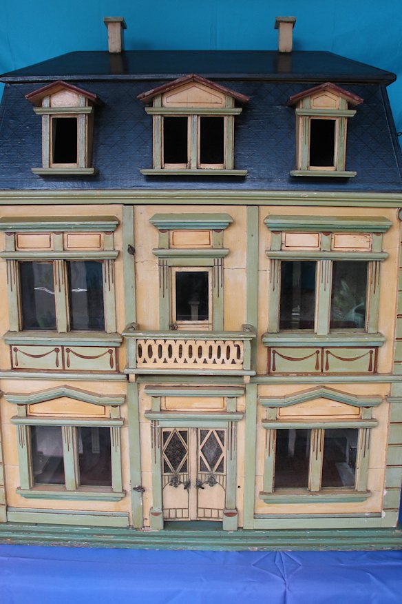 A vintage 1870s doll house up for auction for an estimated price of between $6,000 and $8000.