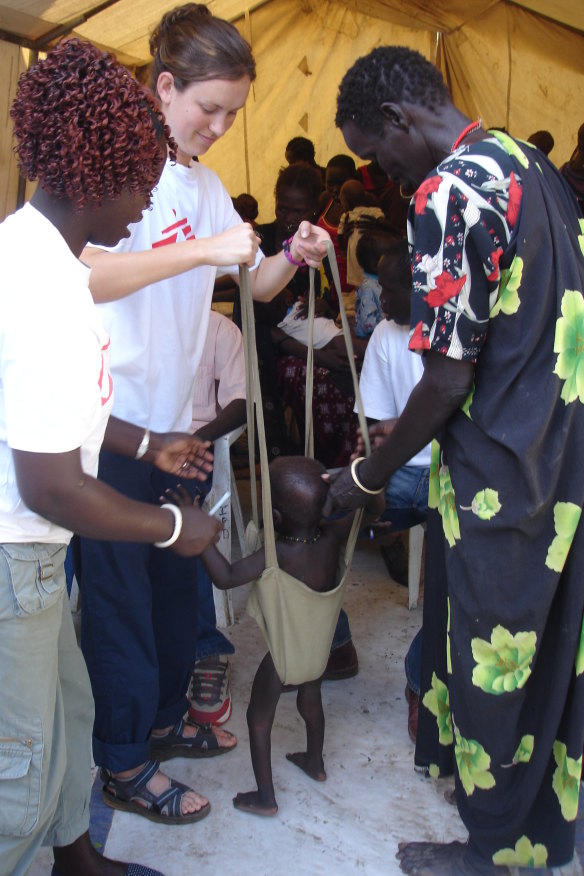 Kent weighs a young child ahead of admission. Children are regularly admitted for malnutrition.