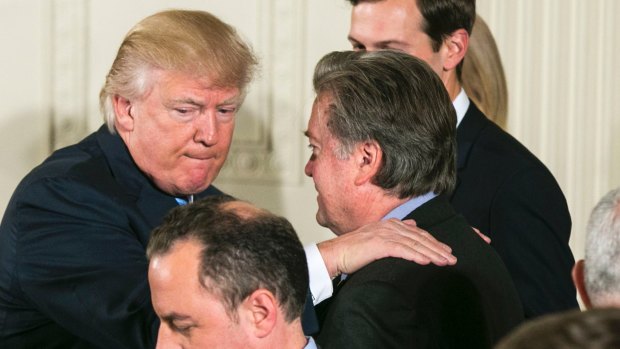 US President Donald Trump congratulates Steve Bannon, his then chief strategist, last year. Bannon is a former backer and vice-president of Cambridge Analytica. 