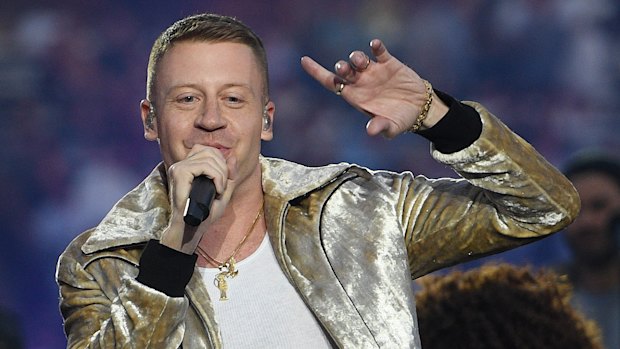 Rapper Macklemore performs Same Love during the NRL grand final.