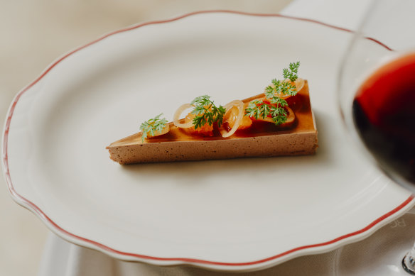 Duck liver parfait is topped with Bandol  rosé jelly and pretty pickles.