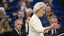Mark Carney watches as Ursula von der Leyen gives her speech in Strasbourg.