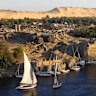 Feluccas moored at the ancient ruins of Swenet on Elephantine Island in Aswan.