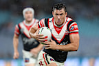 Joseph Manu runs the ball down the line. (Photo by Cameron Spencer/Getty Images)