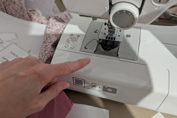 Sewing machine bobbin cover in place