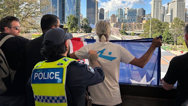 The 52-year-old man at the Brisbane rally was detained but not arrested, allegedly for breaching the peace.