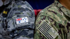 Australian Navy ensign and United States Navy ensign, side by side during Exercise Cyber Sentinels in 2023.