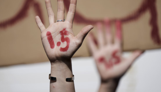 Demonstrators urge compliance with net-zero policies that might keep global warming to 1.5 degrees or below.