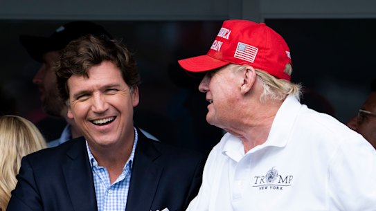 Fox News prime time host Tucker Carlson with former president Donald Trump last year.