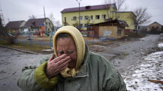  A woman cries outside houses damaged by a Russian airstrike, according to locals, in Gorenka, outside the capital Kyiv, Ukraine.