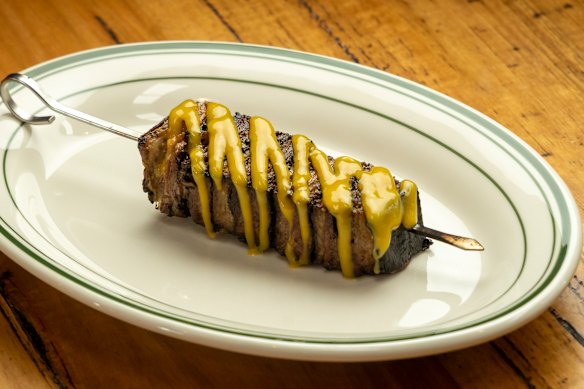 Lamb belly is slow-cooked, pressed into a skewer, then flame-licked to order.