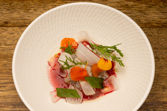 The “French but fresh” cured garfish with blood orange, radish and Tasmanian pepperberry.