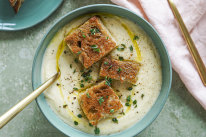 Cauliflower, thyme and potato soup topped with mini cheese toastie bites.