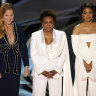 Hosts Amy Schumer, from left, Wanda Sykes, and Regina Hall appear on stage.