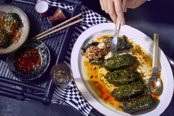 Kale rolls with spicy merguez sausage and rice.