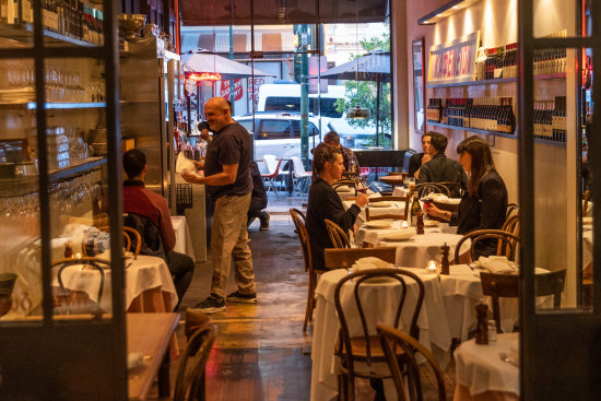 Con Christopoulos can often be found on the floor at his first Greek restaurant, Kafeneion.