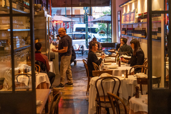 Con Christopoulos can often be found on the floor at his first Greek restaurant, Kafeneion.