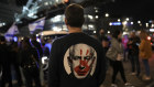 In Tel Aviv on January 20, a protester wears a shirt depicting Israeli Prime Minister Benjamin Netanyahu attempt during a demonstration demanding the release of the hostages in Gaza.
