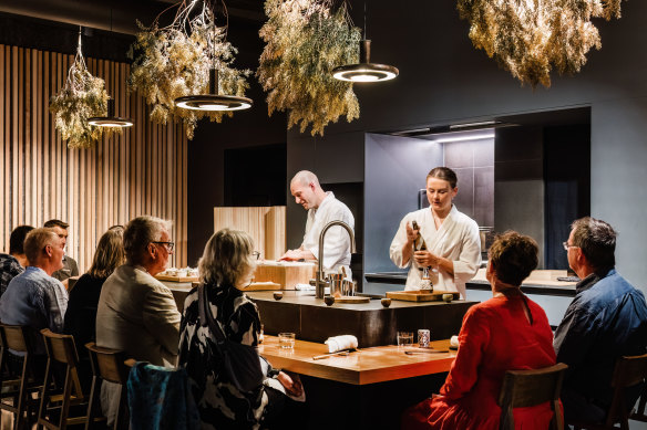 Lachlan Colwill and Sophie Pope behind the Omotenashi counter inside Hobart’s Lexus showroom.