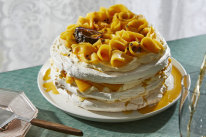 Pavlova stack with passionfruit and mango.