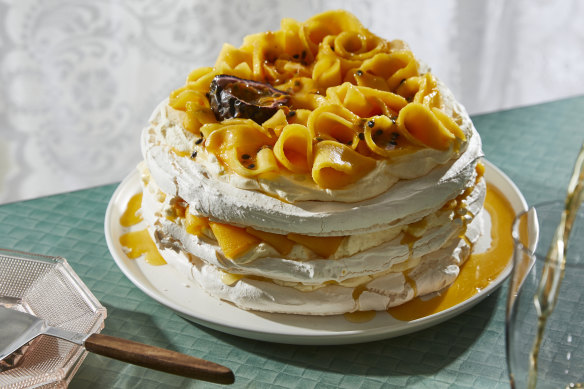 Pavlova stack with passionfruit and mango.