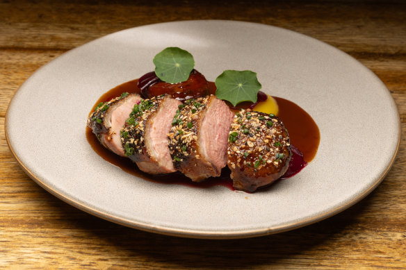 Dry-aged duck breast, with golden beet, pistachio and duck neck sausage.